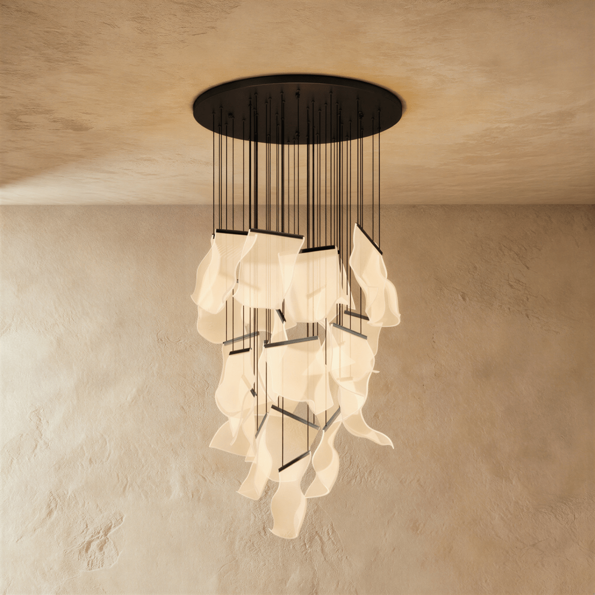 Clérachic brilliant black chandelier shown with its full cascade of glowing acrylic sheets against a plaster wall.