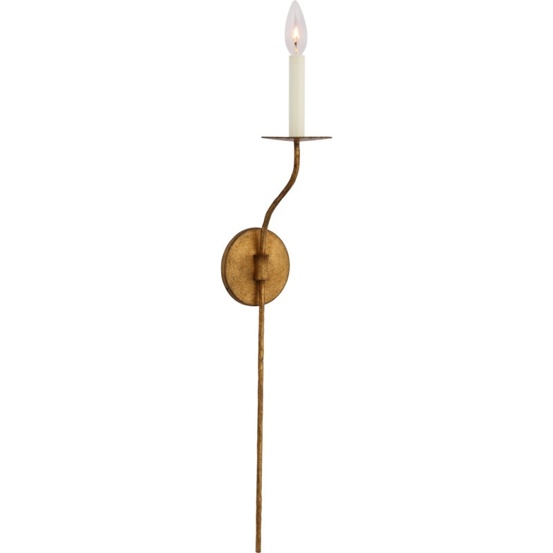 Clérachic's Eris wall lamp photographed straight-on in brass, a cream candle cover topping the arm.
