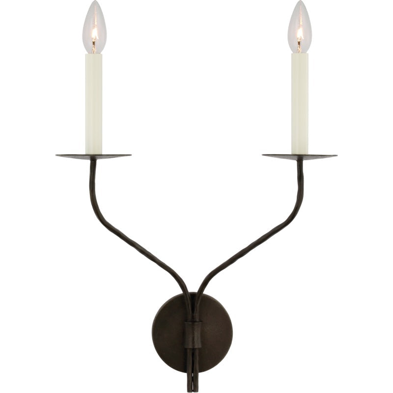 The Clérachic Eris wall lamp's two-arm design in a darker bronze finish, both bulbs lit against white.