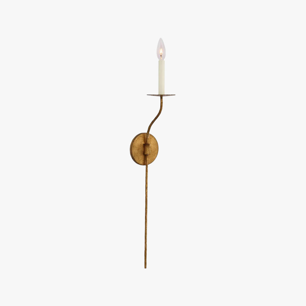 Clérachic's Eris wall lamp in brass, unlit, its slender arm standing straight against white.