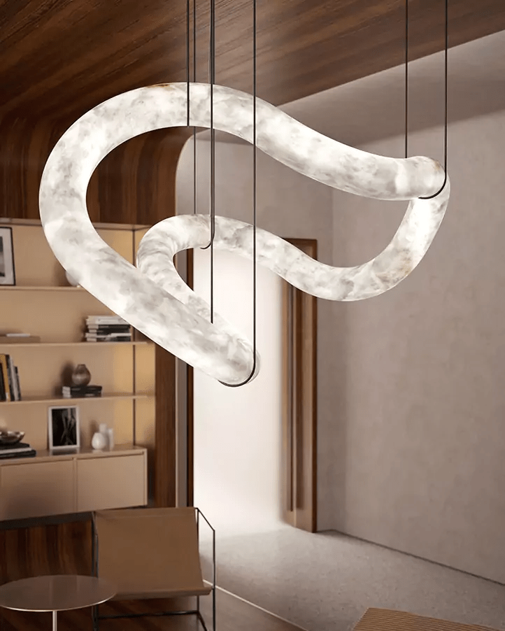 Close view of the Clérachic Ethereal loop, veined alabaster glowing against timber boards.