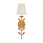 Clérachic's Evoque sconce in antique gold leaf, its leaf-stem body rising to a cream fabric shade.