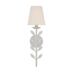 The Clérachic Evoque sconce in a crisp white finish, its sculpted leaf motif catching soft light.