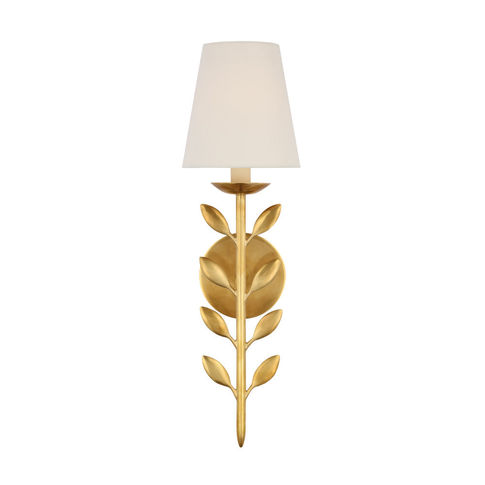 Clérachic's Evoque sconce in polished brass, its glossy leaf cluster set beneath a cream shade.
