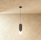 Clérachic single pendant with a charcoal grey fabric pill panel over a milk white glass globe on a black cord.