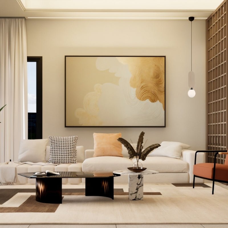 Clérachic pendant with a pale fabric panel and a white glass globe, hung in a bright lounge before a large gold-toned painting.