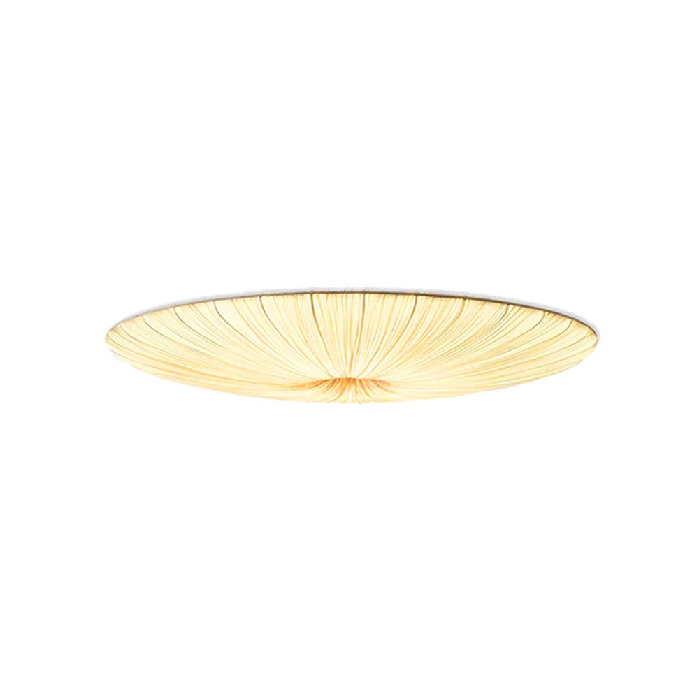 Clérachic pleated flush light on a white backdrop, lit, showing the folds drawn into the centre.