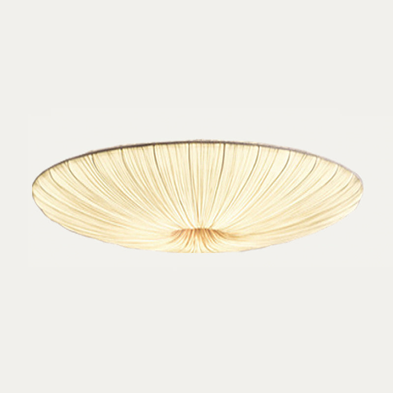 Largest Clérachic pleated ceiling light on a pale grey backdrop, lit warm, its fine folds fanning wide from the centre.
