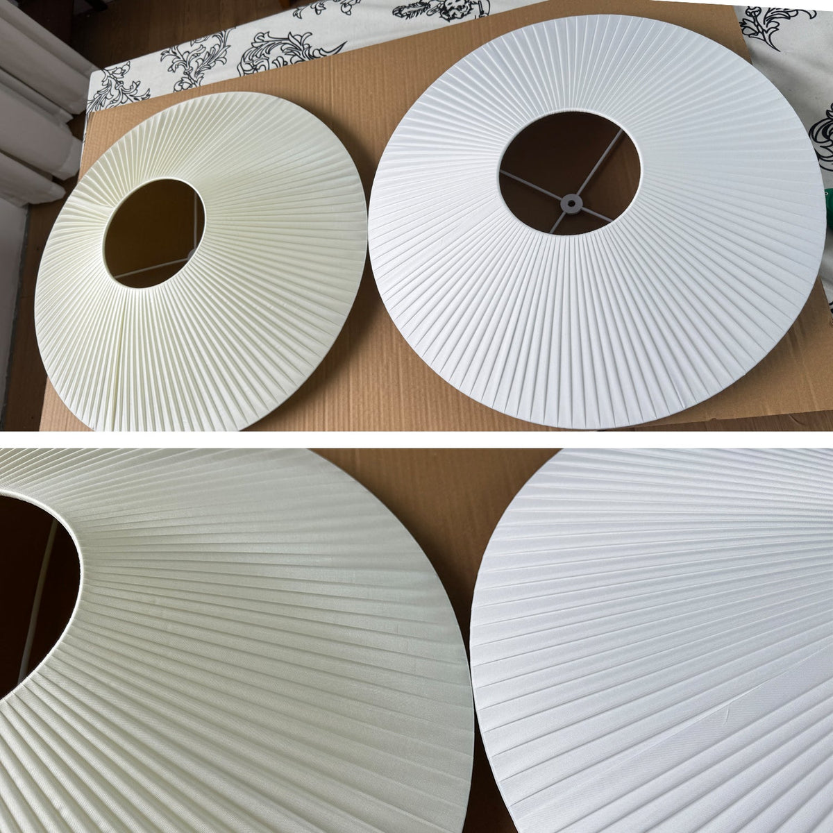 Two flat, ribbed white fabric shade discs with centre holes laid on a table, with a close view of the fine pleats on this Clérachic ceiling light.