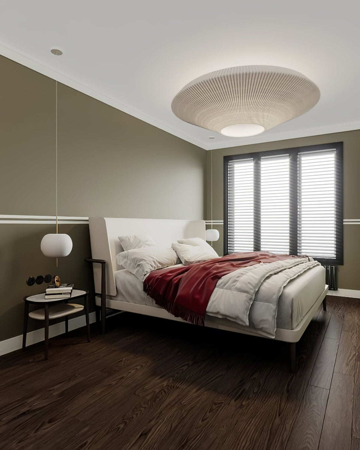 Clérachic pleated ceiling light in cream above a bedroom with an olive wall, a dark wood floor and a bed with a red throw.