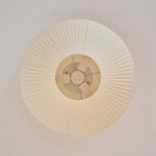 View from directly below at the pleats of this Clérachic ceiling light and the inner fitting around the diffuser.