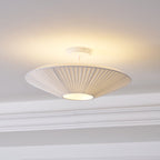 Clérachic white pleated ceiling light on a short stem, glowing warm above a moulded cornice.