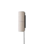 Grey linen Clérachic cylinder wall light, unlit, seen from the side on white, its black back plate and cord clear.
