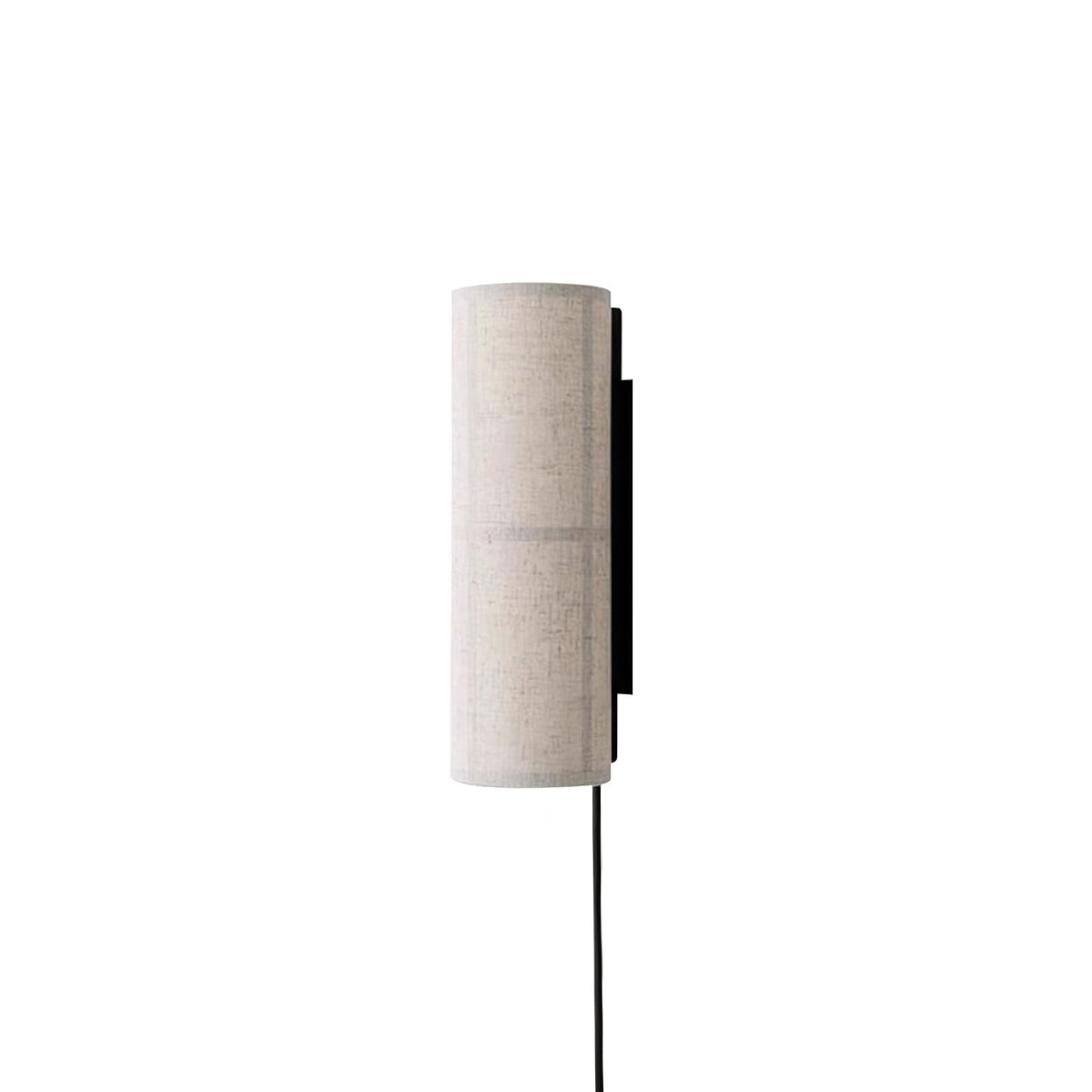 Grey linen Clérachic cylinder wall light, unlit, seen from the side on white, its black back plate and cord clear.