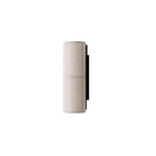 Grey-linen Clérachic wall light, unlit, on a white backdrop, its textured fabric shade and black back plate in profile.