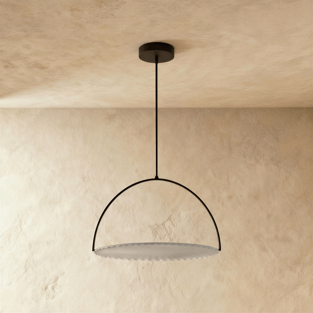 Clérachic black steel arch pendant with a pleated white fabric disc, switched off and hung on a rod from a plaster ceiling.