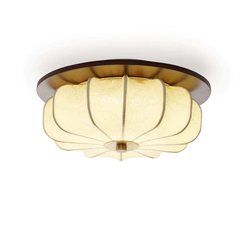 Close view of a Clérachic ceiling light with a walnut rim and a glowing ribbed fabric shade, on a plain white backdrop.