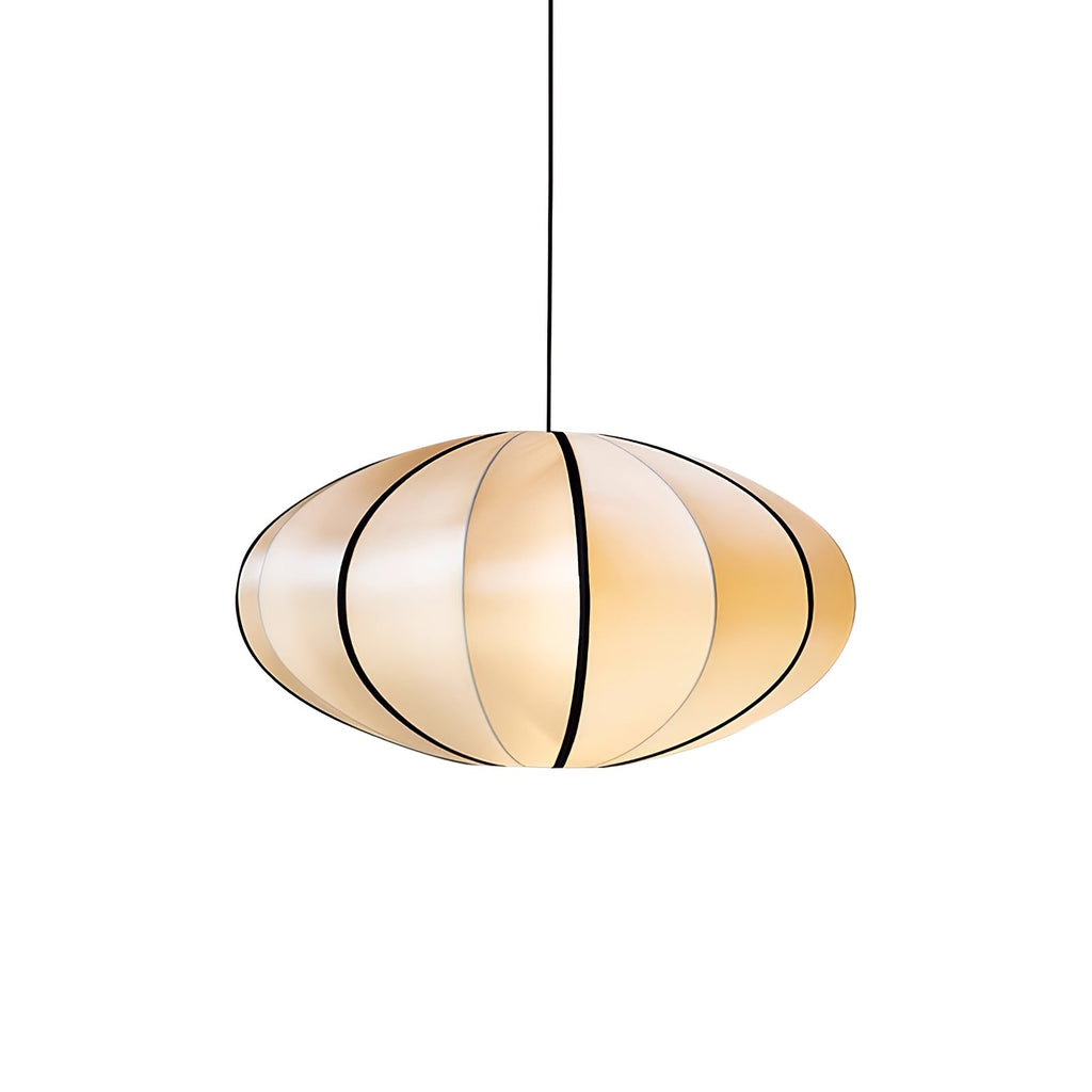 A small rounded fabric pendant with black ribs and a warm glow hangs on a black cord against a white backdrop, from Clérachic.