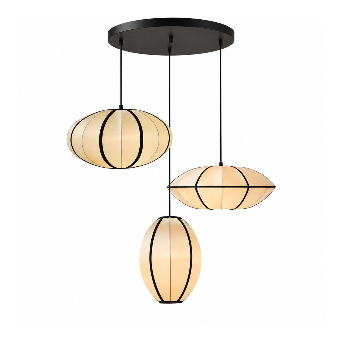 Three fabric pendants, one oval, one pointed and one egg-shaped, hang from a round black ceiling plate against white, from Clérachic.