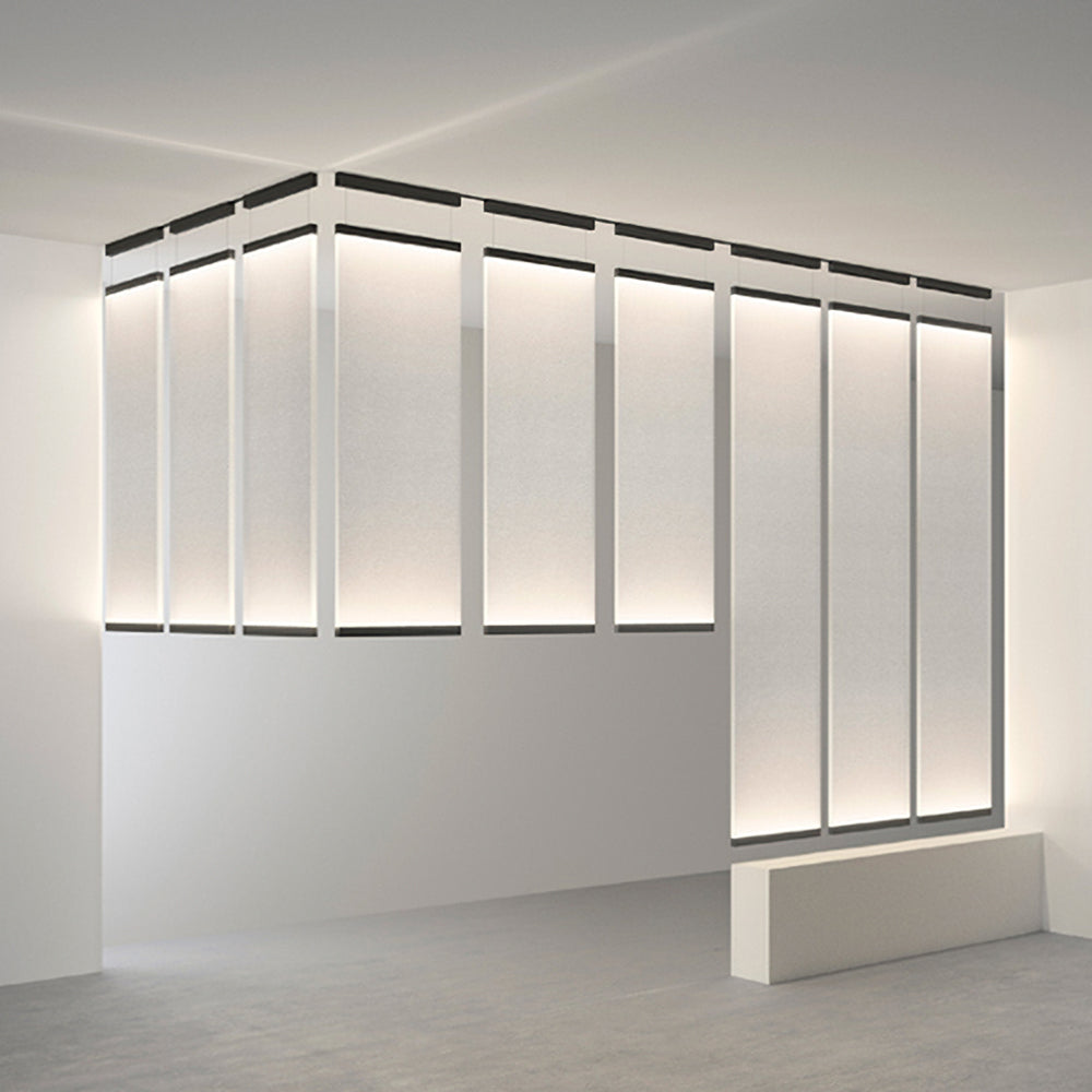 Many Clérachic fabric panels lit as a wall of tall strips, each framed by a dark bar at the top, in a white room.