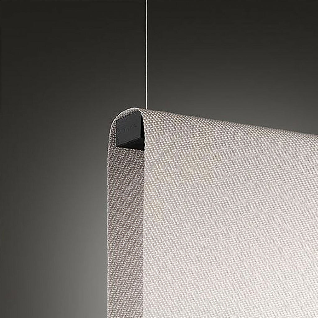 Close view of the rolled top corner of this Clérachic fabric pendant, with a diagonal weave and a black end cap on a thin wire.