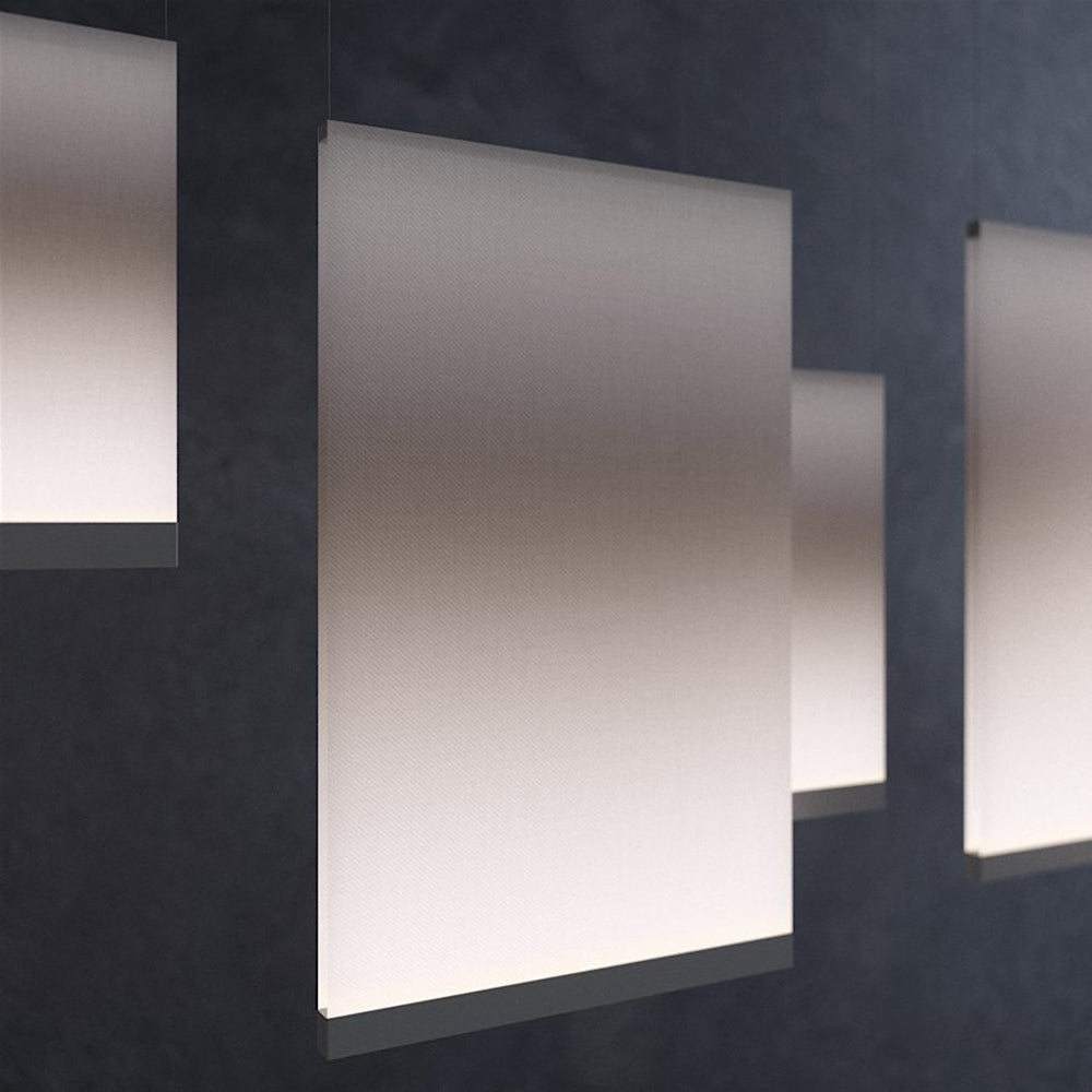 Pale Clérachic fabric panel pendants overlapping in a dark backdrop, one large panel in the centre with its lower edge in shadow.