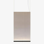 Tall Clérachic fabric pendant with a black bottom bar, hung on two wires, the fabric fading from taupe to cream at the base.