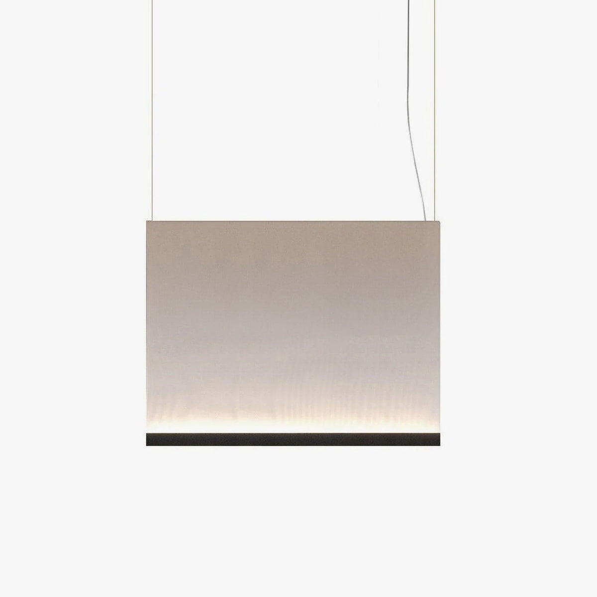 Wide, low Clérachic fabric pendant with a black bottom bar, hung on two thin wires, with a soft glow along the lower edge.
