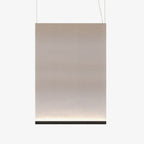 Large tall Clérachic fabric pendant with a black bottom bar and two thin wires, the taupe fabric fading to a pale lit base.