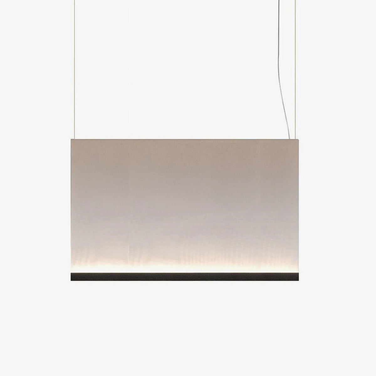 Wide, low Clérachic fabric pendant with a black bottom bar, hung on two wires, glowing softly along its lower edge.