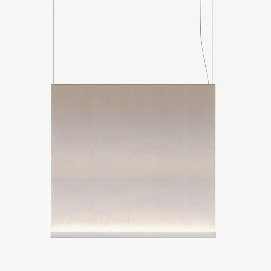 Broad Clérachic fabric pendant with a white bottom bar, hung on two wires, the taupe fabric fading to a lit base.