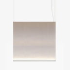 Broad Clérachic fabric pendant with a white bottom bar, hung on two wires, the taupe fabric fading to a lit base.