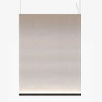 Large portrait Clérachic fabric pendant with a black bottom bar, on two thin wires, with the taupe fabric glowing at the base.