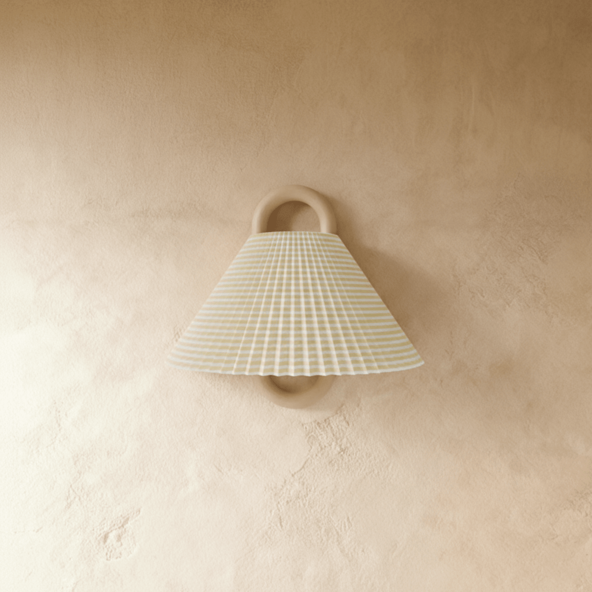Clérachic wall light with a pleated sage and cream striped fabric shade on a wood ring mount, unlit against a plaster wall.