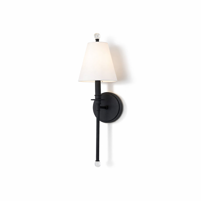 Black Clérachic wall light with a softly lit white shade, shown whole on a plain white backdrop.