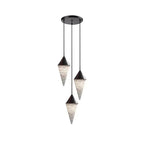 Three black-capped alabaster drops on this Clérachic chandelier hang close together on black cords, on a plain background.
