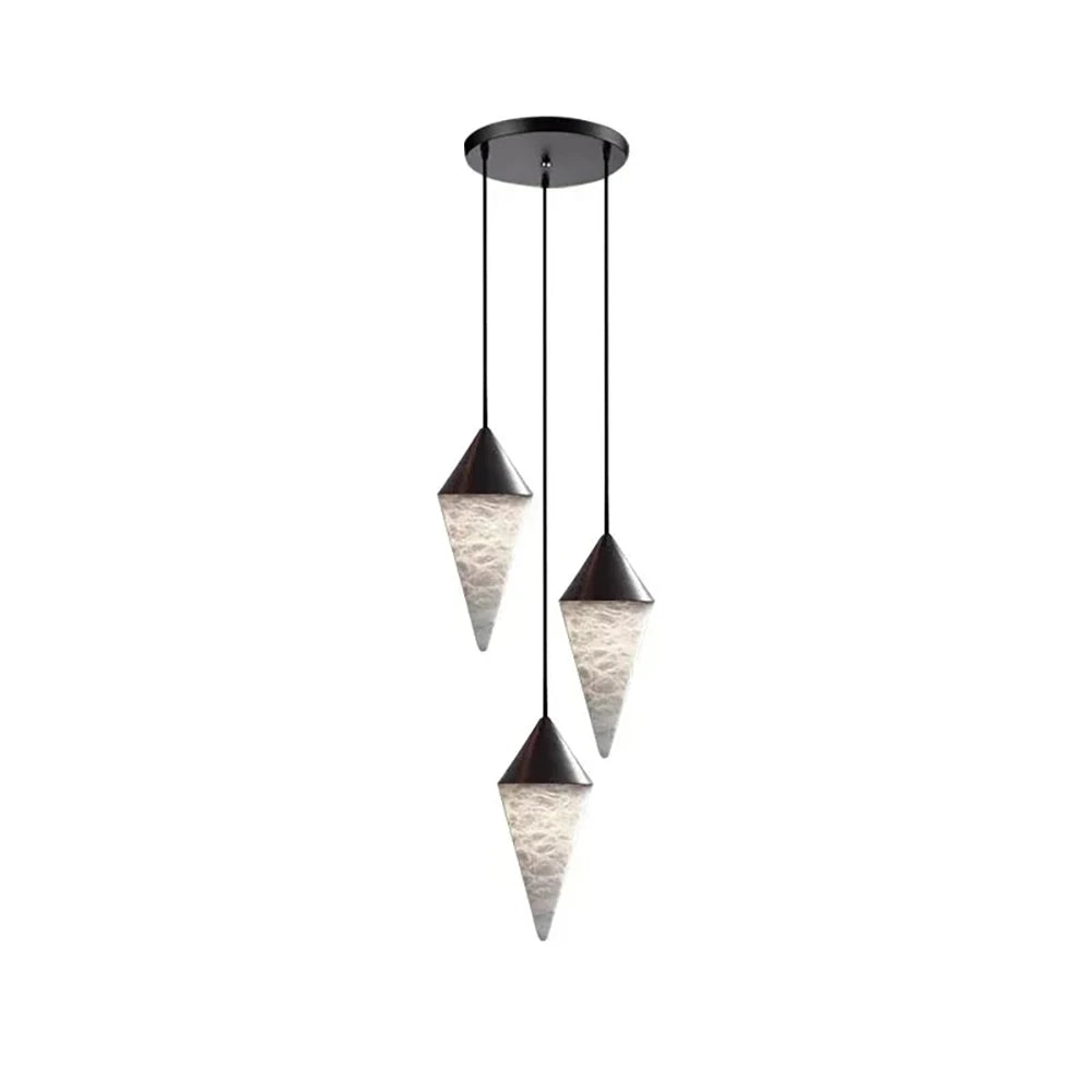 Three black-capped alabaster drops on this Clérachic chandelier hang close together on black cords, on a plain background.