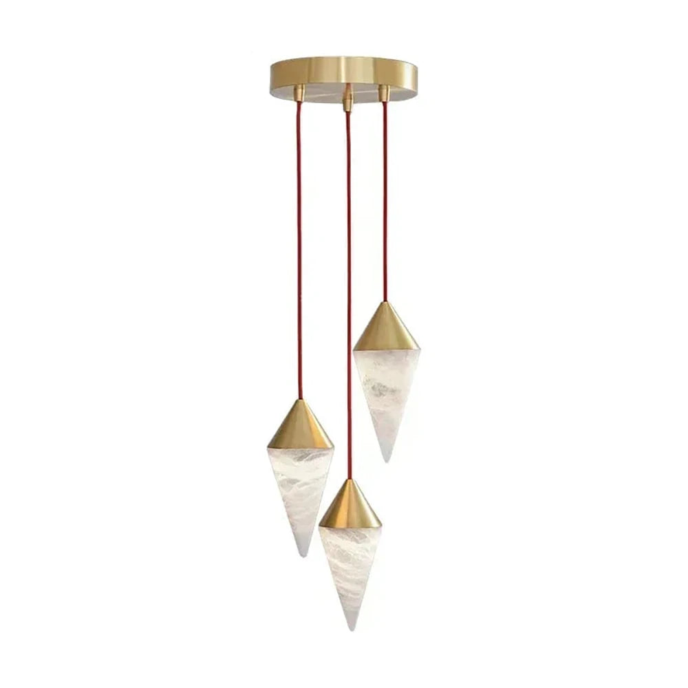 Two brass-capped alabaster drops on this Clérachic chandelier hang side by side on red cords, on a plain background.