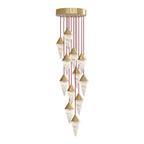 Red cords carry a tall spiral of brass-capped drops on this Clérachic chandelier, on a plain background.