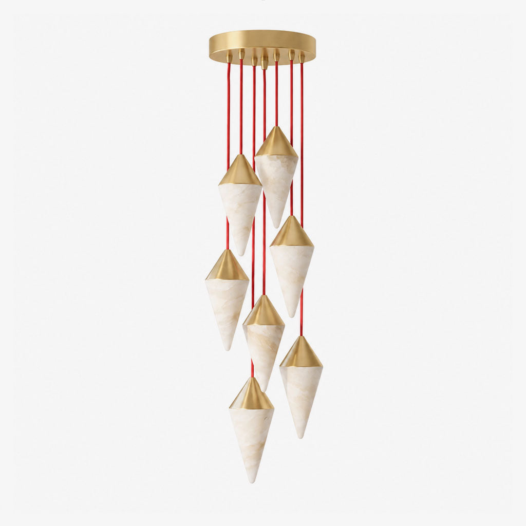 A soft grey background sets off this Clérachic chandelier's spiral of brass-capped drops on red cords.