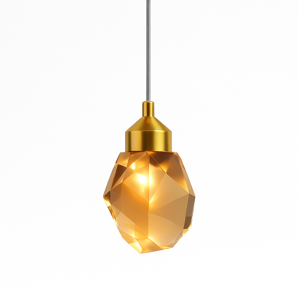Clérachic faceted crystal pendant light lit warmly, its amber glow caught in the cut facets beneath a brushed gold cap.