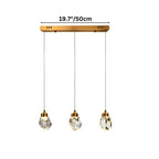 Clérachic three-head linear crystal pendant light on a slim gold bar canopy, drops hung in a straight row with the width marked.