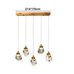 Clérachic five-head linear crystal pendant light on a long gold bar canopy, staggered faceted drops with the width marked.
