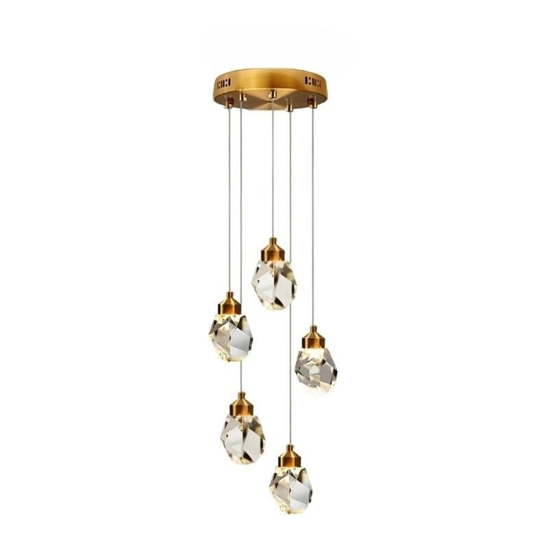 Clérachic five-head round crystal pendant light with faceted drops at staggered heights below a gold circular canopy.