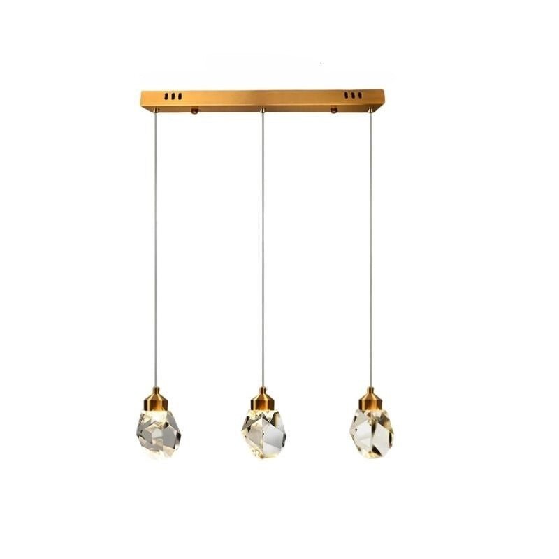 Clérachic three-head linear crystal pendant light with evenly spaced faceted drops hanging from a slim gold bar canopy.