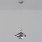 A faceted smoke grey glass pendant on a chrome rod and ceiling plate hangs against a grey backdrop, from Clérachic.