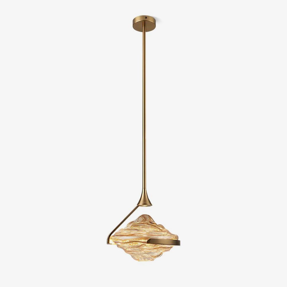 A faceted amber glass pendant with a gold arm and rod hangs against a plain white backdrop, with a small ceiling plate above, from Clérachic.