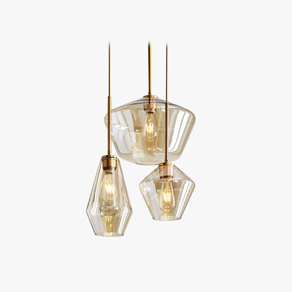 All three sizes of the Clérachic faceted glass pendant light in amber, bowl, teardrop and taper hung together on white.