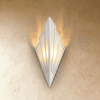 Clérachic Art Deco wall lamp in white, fan-shaped linen panels in a white metal frame, casting warm light up the wall.