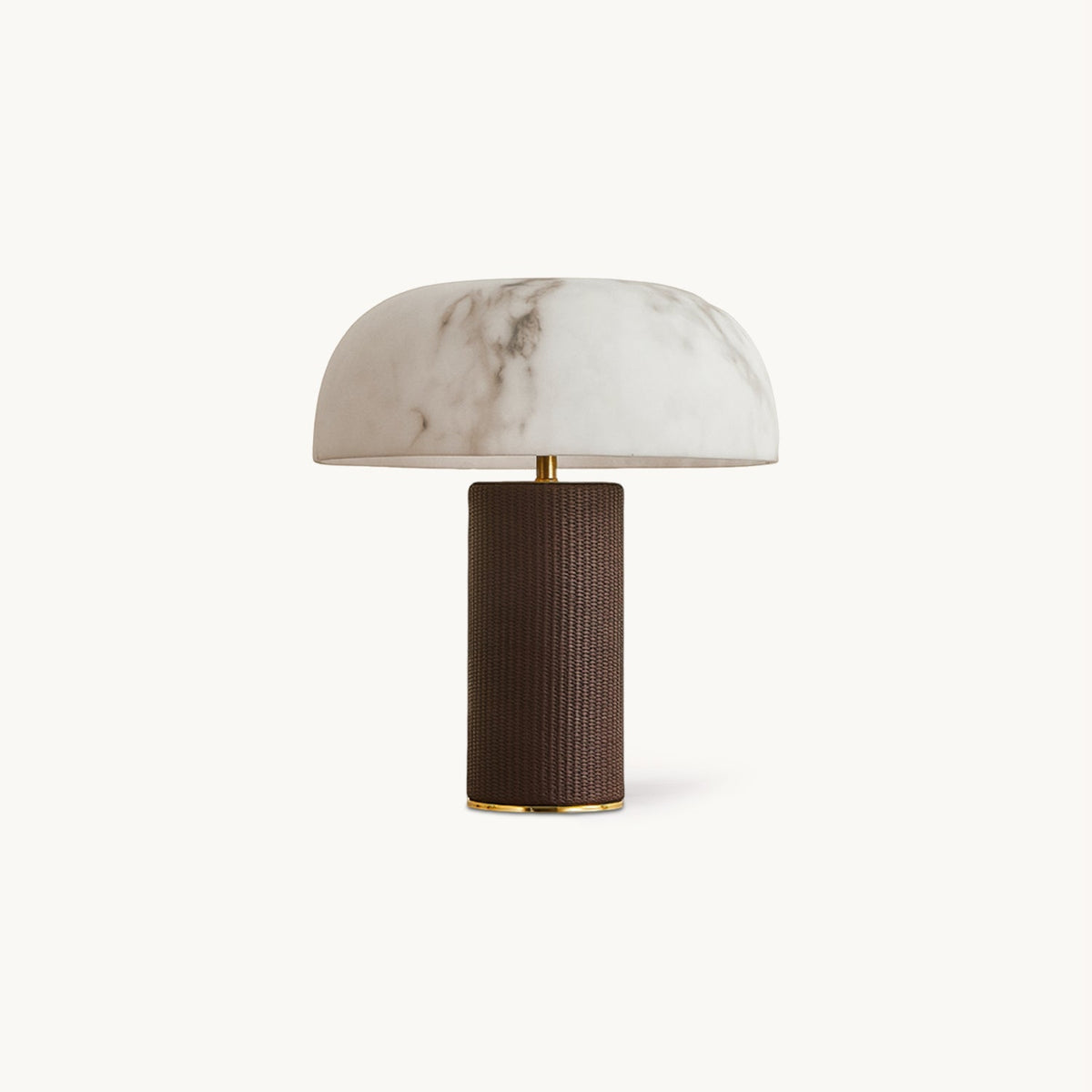 Marbled white domed shade on a dark brown woven-leather base with a gold trim, a Clérachic table lamp on a plain backdrop.